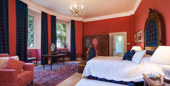 Bedroom 'The Glorious 12th' (King size double) Grand bow-fronted room celebrating Victorian country sports, with an antler chandelier, hand-woven Hume tartan throughout and an en-suite turret bathroom. 